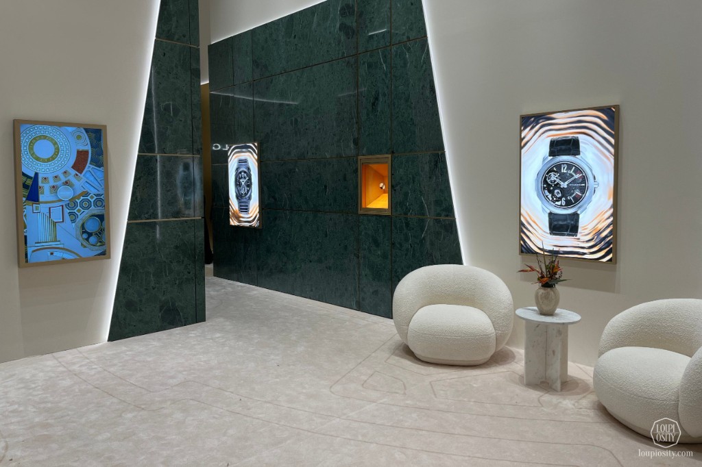 Beyond Time — green marble walls with interactive video screens of Bvlgari watches and lounge seating