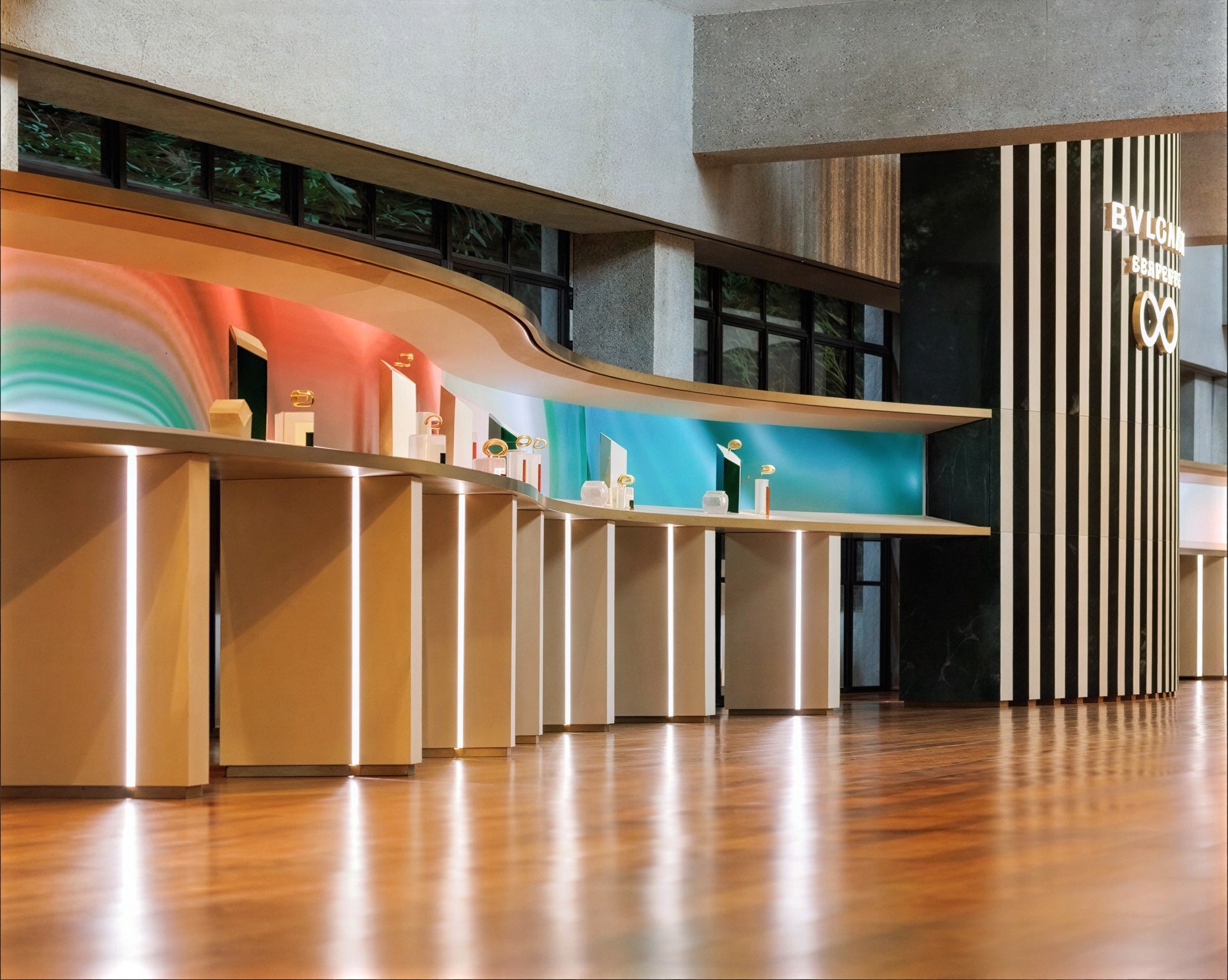 Human as a Catalyst — row of curved interactive stations with colour-shifting screens