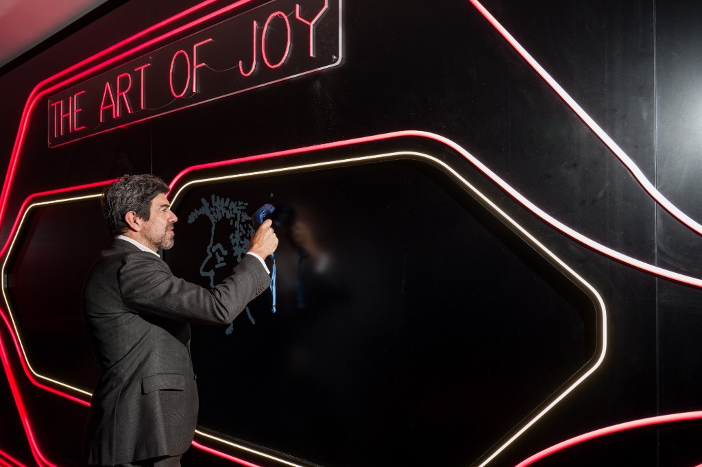 Make it Real — Pierfrancesco Favino drawing on the interactive board at The Art of Joy